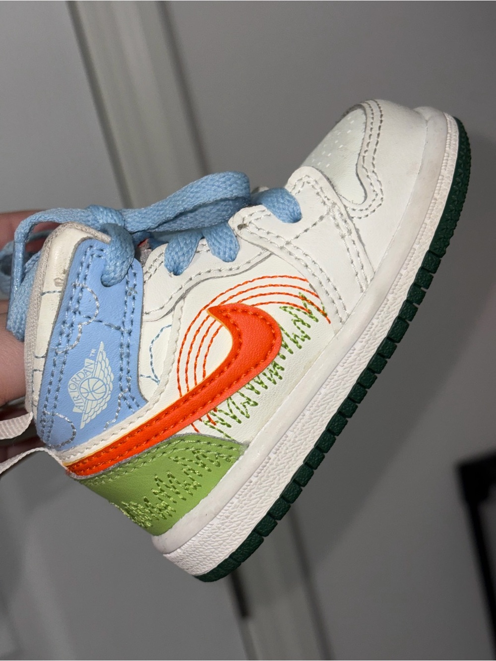 Jordan Kids White, Orange & Green High-Top Sneaker with Light Blue Accents
